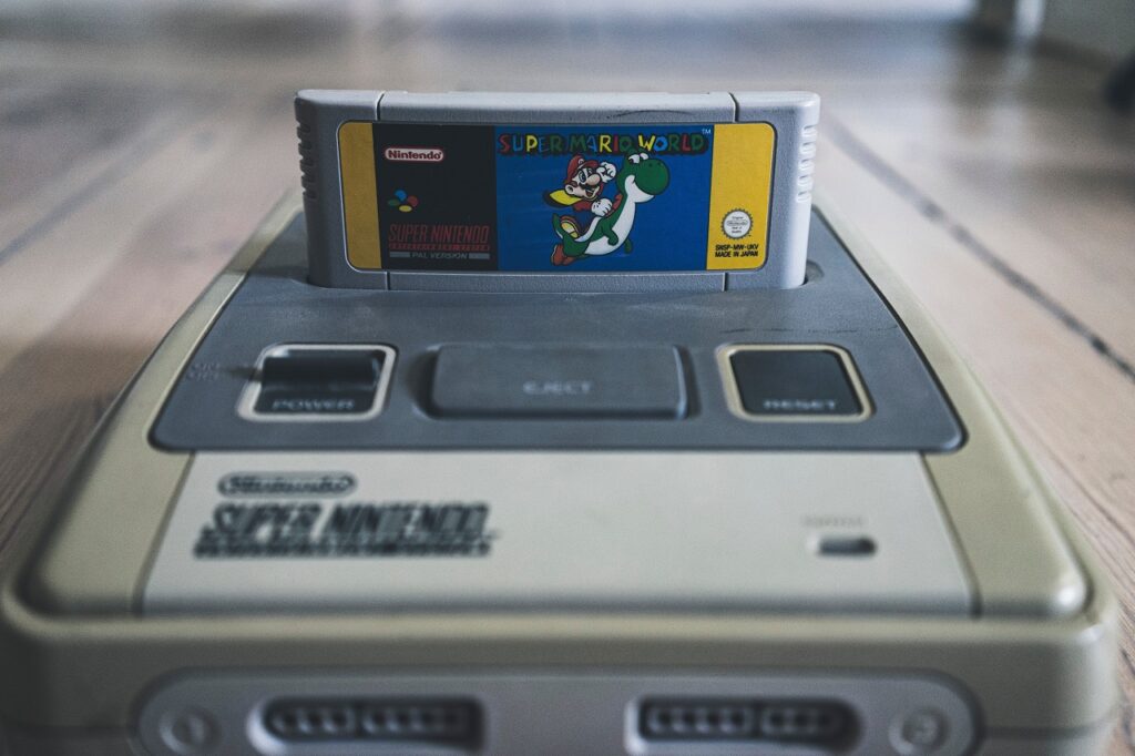 Super Mario World game cartridge inserted into the NES